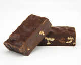 2 Pieces of Chocolate Bourbon Pecan Fudge.  The Fudge is a rich chocolate color with Pecans mixed into the Fudge. 